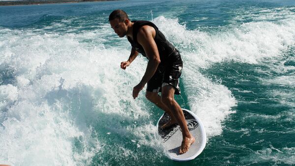 Riding the Wave: Russian Athletes Boost Wake Surfing Amid Ban Controversy