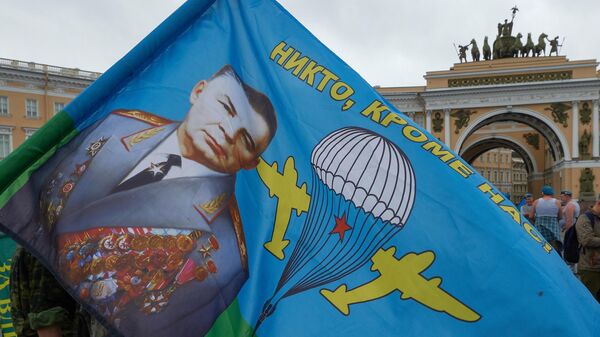 Soviet VDV Commander General Vasily Margelov's portrait emblazoned on a VDV flag with the phrase No one but us! at a Russian Airborne Forces Day celebration in St. Petersburg. File photo. - Sputnik International