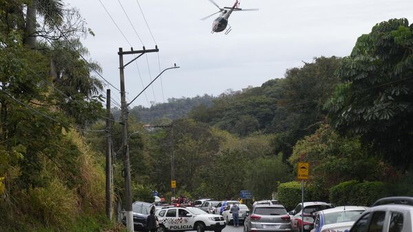 Police patrol the street leading to the gated community where a plane crashed in Vinhedo, Sao Paulo state, Brazil, Friday, Aug. 9, 2024.  - Sputnik International