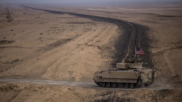 American soldiers drive a Bradley fighting vehicle during a joint exercise with Syrian Democratic Forces in the countryside of Deir Ezzor in northeastern Syria. File photo. - Sputnik International