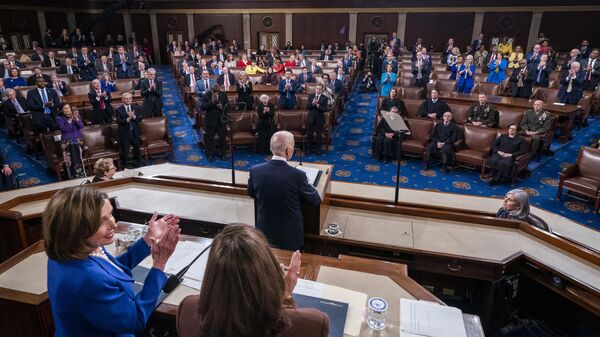 President Joe Biden delivers his first State of the Union address to a joint session of Congress at the Capitol, Tuesday, March 1, 2022, in Washington as Vice President Kamala Harris and House speaker Nancy Pelosi of Calif., look on.  - Sputnik International