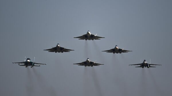 Russian Su-57, Su-34 and Su-35S fighter jets take part in an airshow. File photo. - Sputnik International