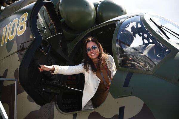 A visitor in an Mi-35P helicopter at the Army 2024 International Military-Technical Forum at the Patriot Exhibition and Convention Center. - Sputnik International