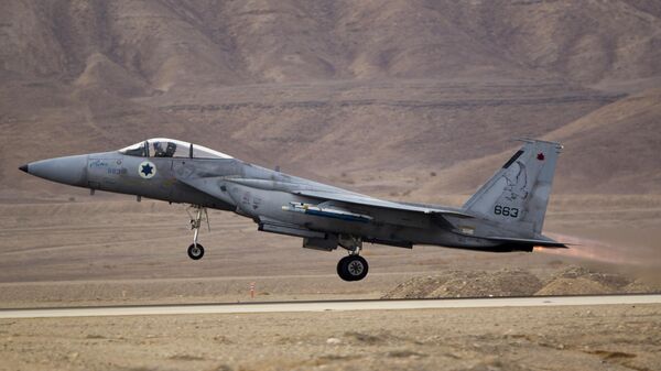 An Israeli air force F-15 takes off from Ovda airbase near Eilat, southern Israel, Monday, Nov. 25, 2013 during the Blue Flag exercise - Sputnik International