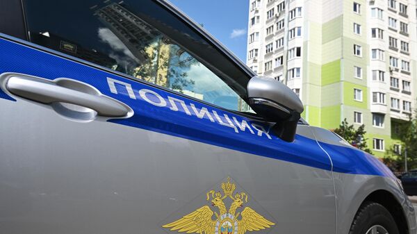 A police car is seen at the site of a car blast that wounded Russian military official Andrei Torgashov and his wife in Moscow, Russia. - Sputnik International