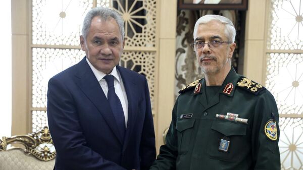 Chief of the General Staff of Iran's Armed Forces Gen. Mohammad Hossein Bagheri, right, shakes hands with Secretary of Russia's Security Council, Sergei Shoigu during their meeting in Tehran, Aug. 5, 2024.  - Sputnik International