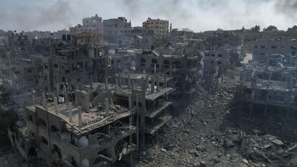 A view of the rubble of buildings hit by an Israeli airstrike, in Jabalia, Gaza strip, Wednesday, Oct. 11, 2023 - Sputnik International