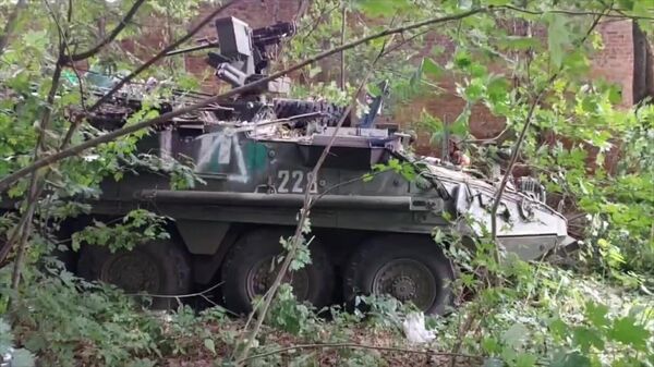 An abandoned armoured vehicle of Ukrainian armed forces is seen at a position captured by Russian servicemen during fighting in one of the settlements of Kursk region, Russia. - Sputnik International