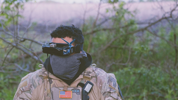 raoulduke_69 shares a picture on social media of a mercenary in Ukraine with an American flag, geotagged to Chasov Yar, April, 2024, The tattoos match those seen on Forward Observation Group's founder Derrick Bales. Published under fair use. - Sputnik International