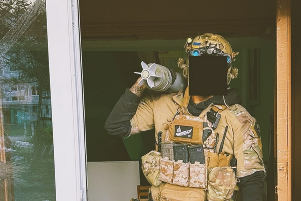 raoulduke_69 shares a picture on social media of a mercenary with a Forward Observation Group patch standing with an artillery shell, geotagged to Chasov Yar, August, 20, 2024, . Published under fair use. - Sputnik International