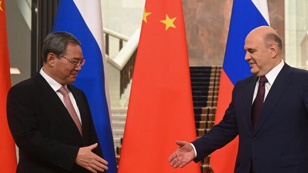 Russian Prime Minister Mikhail Mishustin and Chinese Premier Li Qiang - Sputnik International