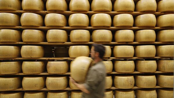 In this photo taken Tuesday, Oct. 8, 2019, Parmigiano Reggiano Parmesan cheese wheels are stored in Noceto, near Parma, Italy.  - Sputnik International