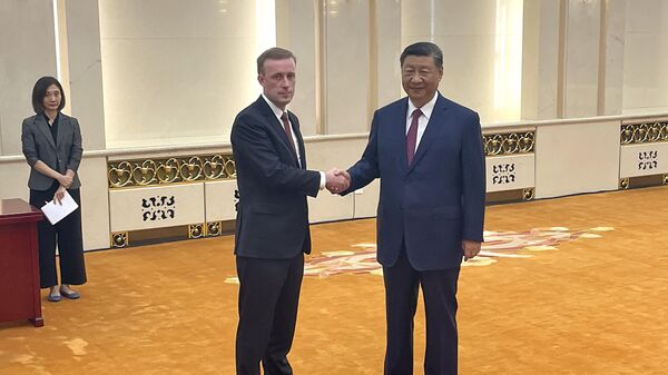 White House national security adviser Jake Sullivan, left, and Chinese President Xi Jinping shake hands at the Great Hall of the People in Beijing, China Thursday, Aug. 29, 2024. (Trevor Hunnicutt/Pool Photo via AP) - Sputnik International