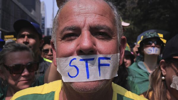 A demonstrator takes part in a protest calling for the impeachment of Supreme Court Minister Alexandre de Morae, in Sao Paulo, Saturday, Sept. 7, 2024. (AP Photo/Ettore Chiereguini) - Sputnik International