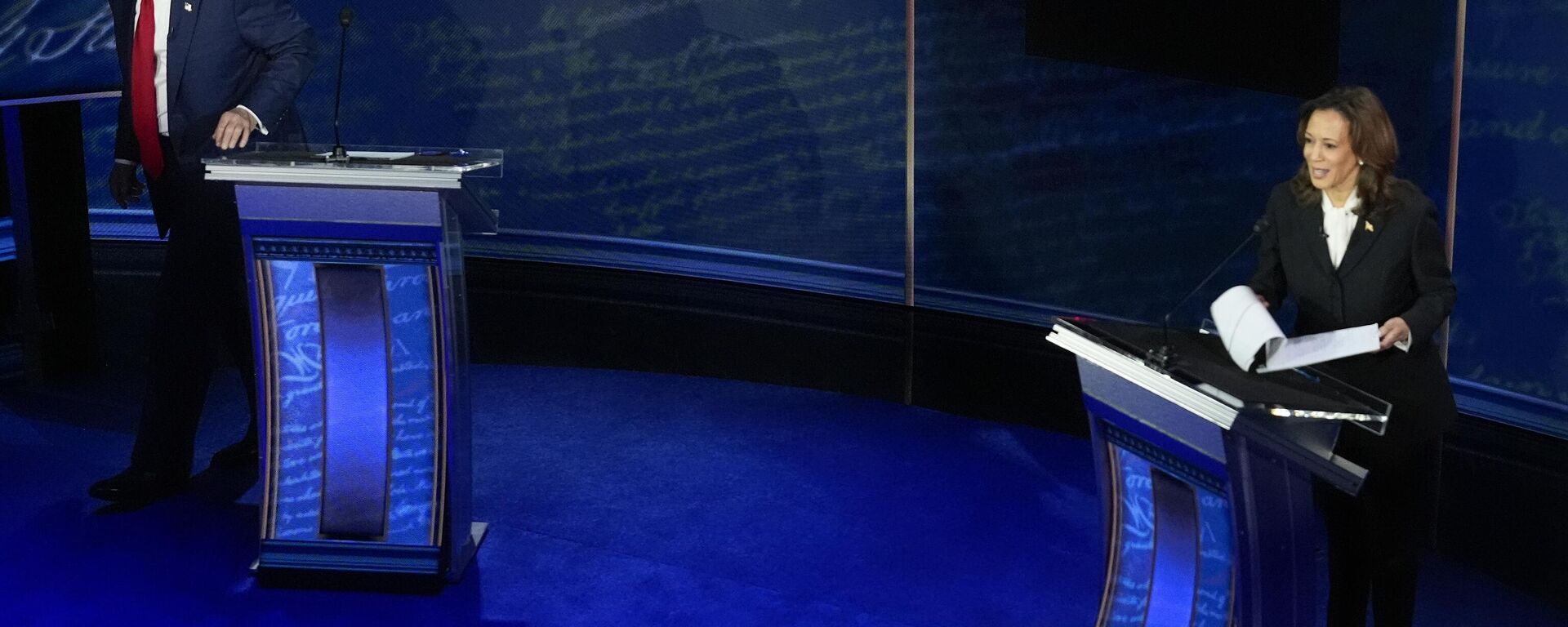 Republican presidential nominee former President Donald Trump, left, walking away from his podium at the end of an ABC News presidential debate with Democratic presidential nominee Vice President Kamala Harris, right, at the National Constitution Center, Tuesday, Sept.10, 2024, in Philadelphia.  - Sputnik International, 1920, 11.09.2024