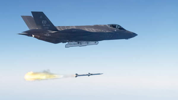 Screenshot of an image showing An F-35 Lightning II launching an AIM-120 advanced medium range air-to-air missile (AMRAAM).  - Sputnik International