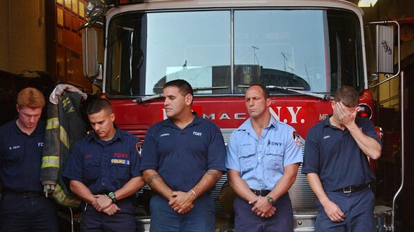 Firefighters with Squad 1 stand for a moment of silence as names of missing firefighters are read at their station in the Park Slope neighborhood of the Brooklyn borough of New York Wednesday, Sept. 11, 2002. Squad 1 lost 12 firefighters in the collapse of the World Trade Center Towers on Sept. 11, 2001 - Sputnik International