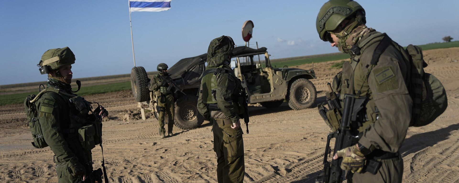 Israeli soldiers are seen near the Gaza Strip border in southern Israel, Monday, March 4, 2024 - Sputnik International, 1920, 06.10.2024