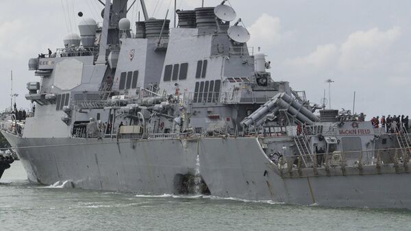 In this Aug. 21, 2017, file photo provided by the US Navy, the guided-missile destroyer USS John S. McCain (DDG 56) steers towards the Changi Naval Base, Singapore, following a collision with the merchant vessel Alnic MC while underway east of the Straits of Malacca and Singapore. Funeral services have been held for a New Jersey man who was among the 10 U.S. sailors killed last month when a Navy ship collided with an oil tanker off Singapore - Sputnik International