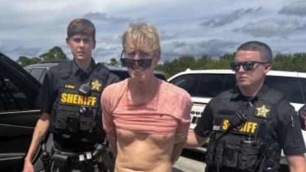 In this imaged released by the Martin County, Fla., Sheriff’s Office, law enforcement officers arrest Ryan Routh, the man suspected in the apparent assassination attempt of Donald Trump, Sunday, Sept. 15, 2024. - Sputnik International