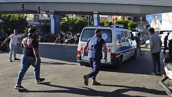 An ambulance carries wounded people whose handheld pager exploded, in Beirut, Lebanon - Sputnik International