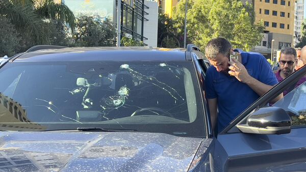 Police officers inspect a car inside of which a hand-held pager exploded, Beirut, Lebanon, Tuesday, Sept. 17, 2024.  - Sputnik International