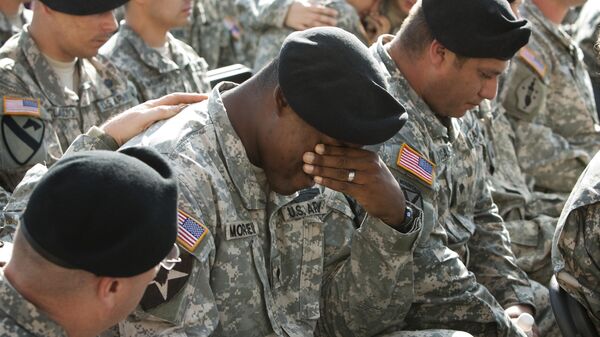 A soldier cries at a memorial service at Fort Hood, Texas, for the victims of the Fort Hood shootings on Tuesday, Nov. 10, 2009 - Sputnik International