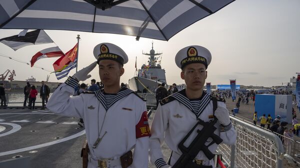 Chinese sailors stand on guard onboard the Chinese guided-missile destroyer Shijiazhuang during a public day to mark the upcoming 75th anniversary of Chinese People's Liberation Army Navy in Qingdao in eastern China's Shandong province on Saturday, April 20, 2024 - Sputnik International