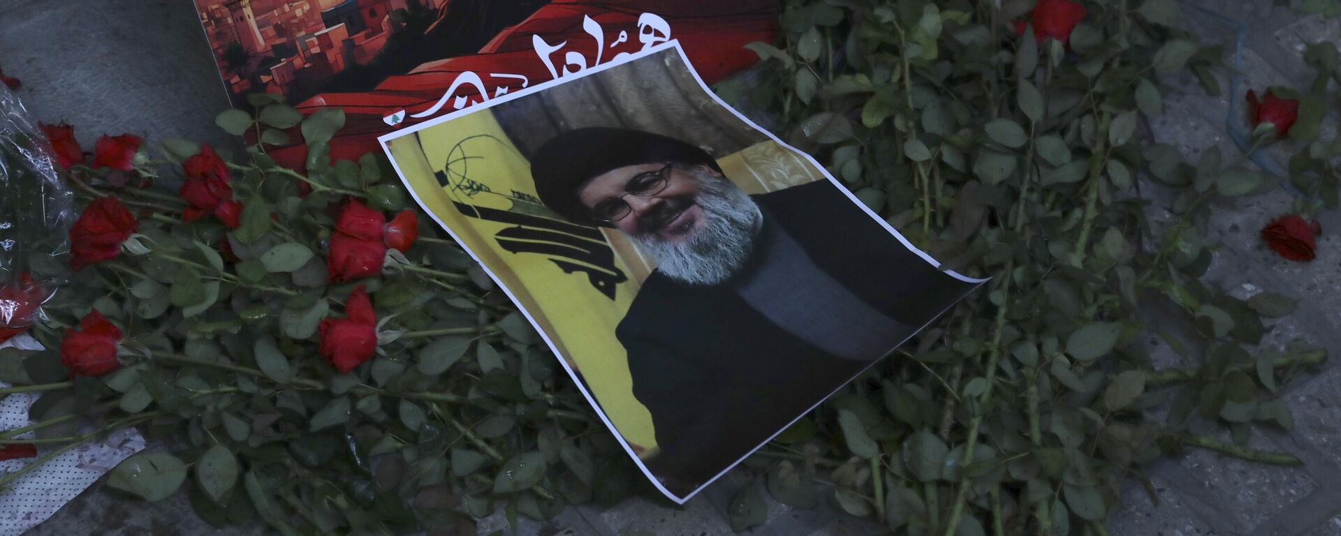 A poster of Hezbollah leader Sayyed Hassan Nasrallah is placed on flowers in front of the Lebanese Embassy in Tehran, Iran, Wednesday, Sept. 18, 2024. - Sputnik International, 1920, 28.09.2024