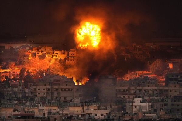 Flames rise after an Israeli airstrike in the southern suburbs of Beirut. - Sputnik International