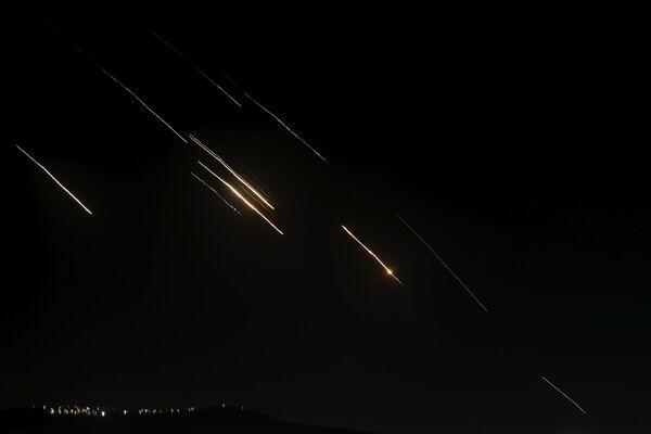 Missiles launched from Iran towards Israel are seen in the West Bank city of Nablus.  - Sputnik International