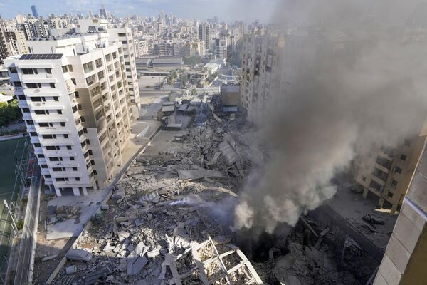 Israel began a massive bombing campaign, codenamed Northern Arrows, in southern and eastern parts of Lebanon on September. Hezbollah, in turn, fired dozens of rockets toward northern Israel.Above: Smoke rises from the site of the Israeli airstrike in Dahieh, Beirut, Lebanon. - Sputnik International