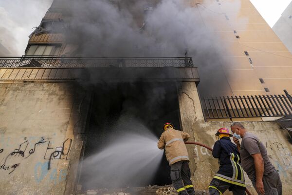 This escalation was preceded by a series of explosions of pagers and walkie-talkies in Lebanon on September 17 and 18, which killed over 40 people and injured nearly 3,500 others.Above: Civil defense workers extinguish a fire at the site of the Israeli airstrike in Dahieh. - Sputnik International