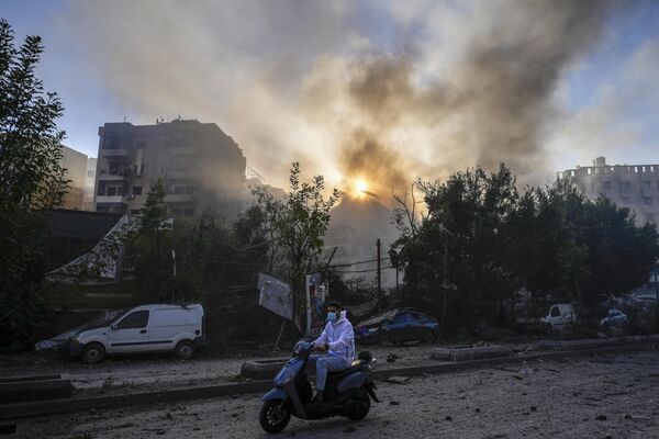 Smoke rises from the site of an Israeli airstrike in Dahieh - Sputnik International