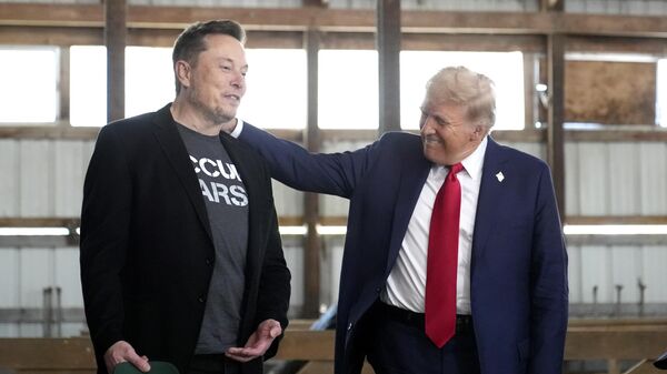 Tesla and SpaceX CEO Elon Musk, left, and Republican presidential nominee former President Donald Trump attend a campaign event at the Butler Farm Show, Saturday, Oct. 5, 2024, in Butler, Pa.  - Sputnik International