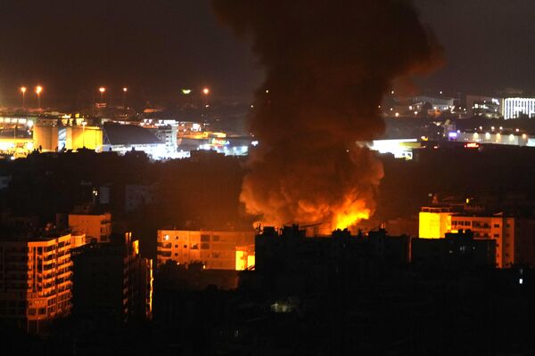 Flames and smoke rise after an Israeli airstrike in Dahiyeh, Beirut, Lebanon. - Sputnik International