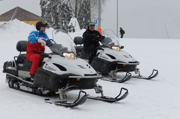 Russian President Vladimir Putin and his Belarusian counterpart Alexander Lukashenko are riding snowmobiles in Sochi, 2021. - Sputnik International