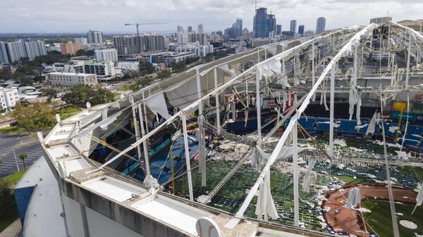 The roof of the Tropicana Field is damaged the morning after Hurricane Milton hit the region, Thursday, Oct. 10, 2024, in St. Petersburg, Fla. (AP Photo/Julio Cortez) - Sputnik International