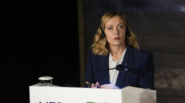 Italian Prime Minister Giorgia Meloni, listens during a news conference in Paphos ,Cyprus, on Friday, Oct 11, 2024 as the leaders of nine southern European Union member countries and Jordan are meeting to come up with ways of de-escalating the conflict in the Middle East - Sputnik International