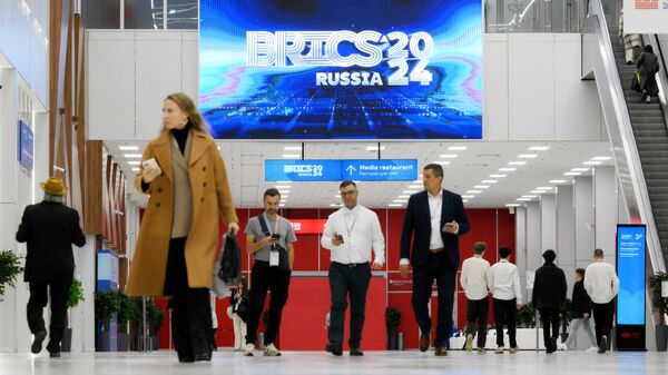 Visitors attend the 16th BRICS Summit in Kazan, Russia. - Sputnik International