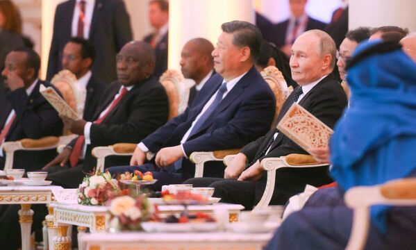 Russian President Vladimir Putin attends a concert preceding the informal dinner for the heads of delegation at the 16th BRICS Summit in Kazan. - Sputnik International