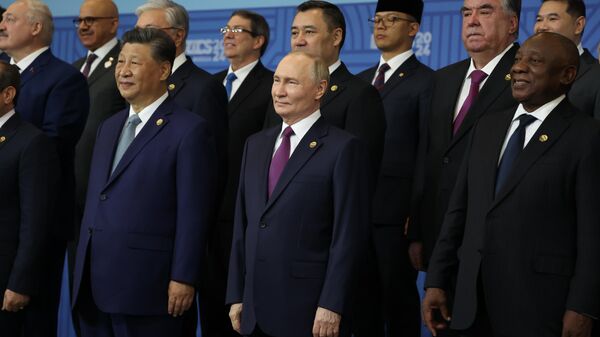 BRICS leaders including Presidents Xi, Putin and Ramaphosa pose for a group photo at the BRICS Summit in Kazan, Russia. October 24, 2024. - Sputnik International