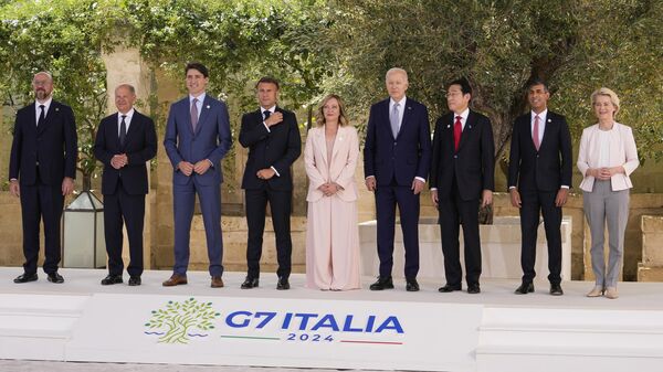 From left, European Council President Charles Michel, German Chancellor Olaf Scholz, Canada's Prime Minister Justin Trudeau, French President Emmanuel Macron, Italian Prime Minister Giorgia Meloni, U.S. President Joe Biden, Japan's Prime Minister Fumio Kishida, Britain's Prime Minister Rishi Sunak and European Commission President Ursula von der Leyen pose for a group photo during a G7 world leaders summit at Borgo Egnazia, Italy, Thursday, June 13, 2024 - Sputnik International