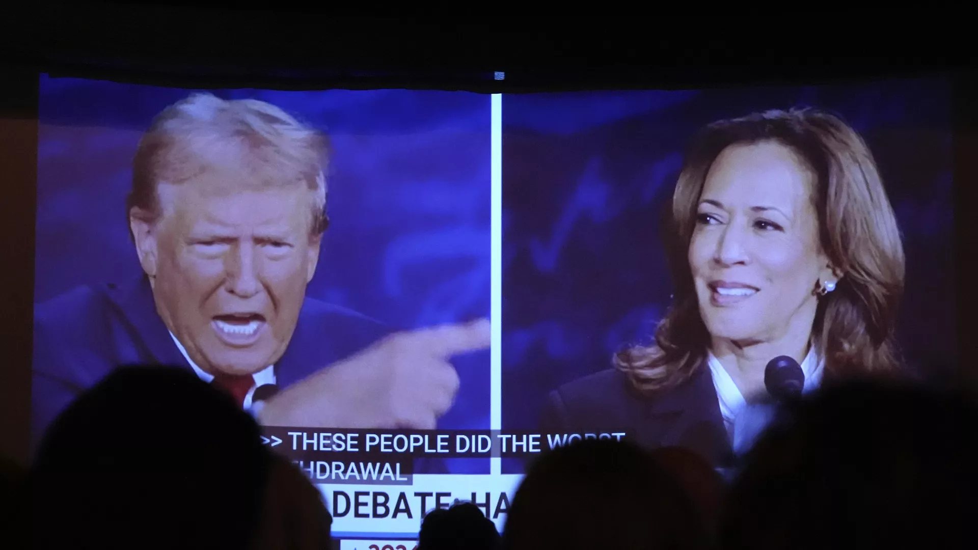 Republican presidential nominee former President Donald Trump, left, and Democratic presidential nominee Vice President Kamala Harris are seen on a screen during a presidential debate as people watch at One Longfellow Square, Tuesday, Sept. 10, 2024, in Portland, Maine.  - Sputnik International, 1920, 31.10.2024