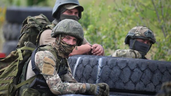 Russian servicemen are seen during combat coordination of an intensive training of scouts of the Yug Battlegroup of forces at a training ground - Sputnik International