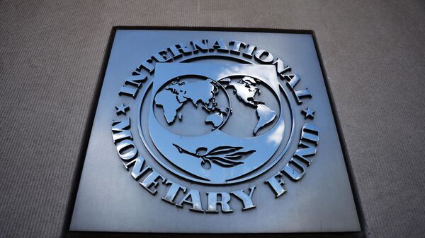 A sign with the International Monetary Fund logo on the wall of the IMF building - Sputnik International