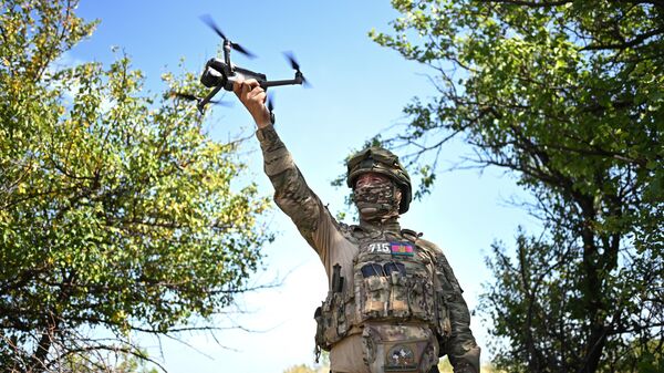 A Russian serviceman with a drone in the special operation zone. File photo - Sputnik International