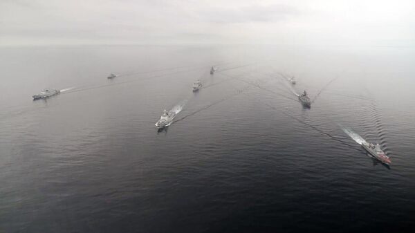 In this handout video grab released by the Russian Defence Ministry, Russian and Chinese Navy ships sail during Russia-China joint naval exercises in the Sea of Japan, China - Sputnik International