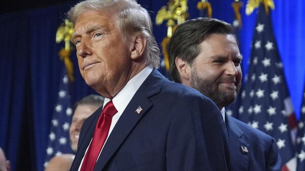 Republican President-Elect Donald Trump and his running mate, Senator JD Vance,  stand on stage at an election night watch party at the Palm Beach Convention Center, Wednesday, Nov. 6, 2024, in West Palm Beach, Florida. - Sputnik International