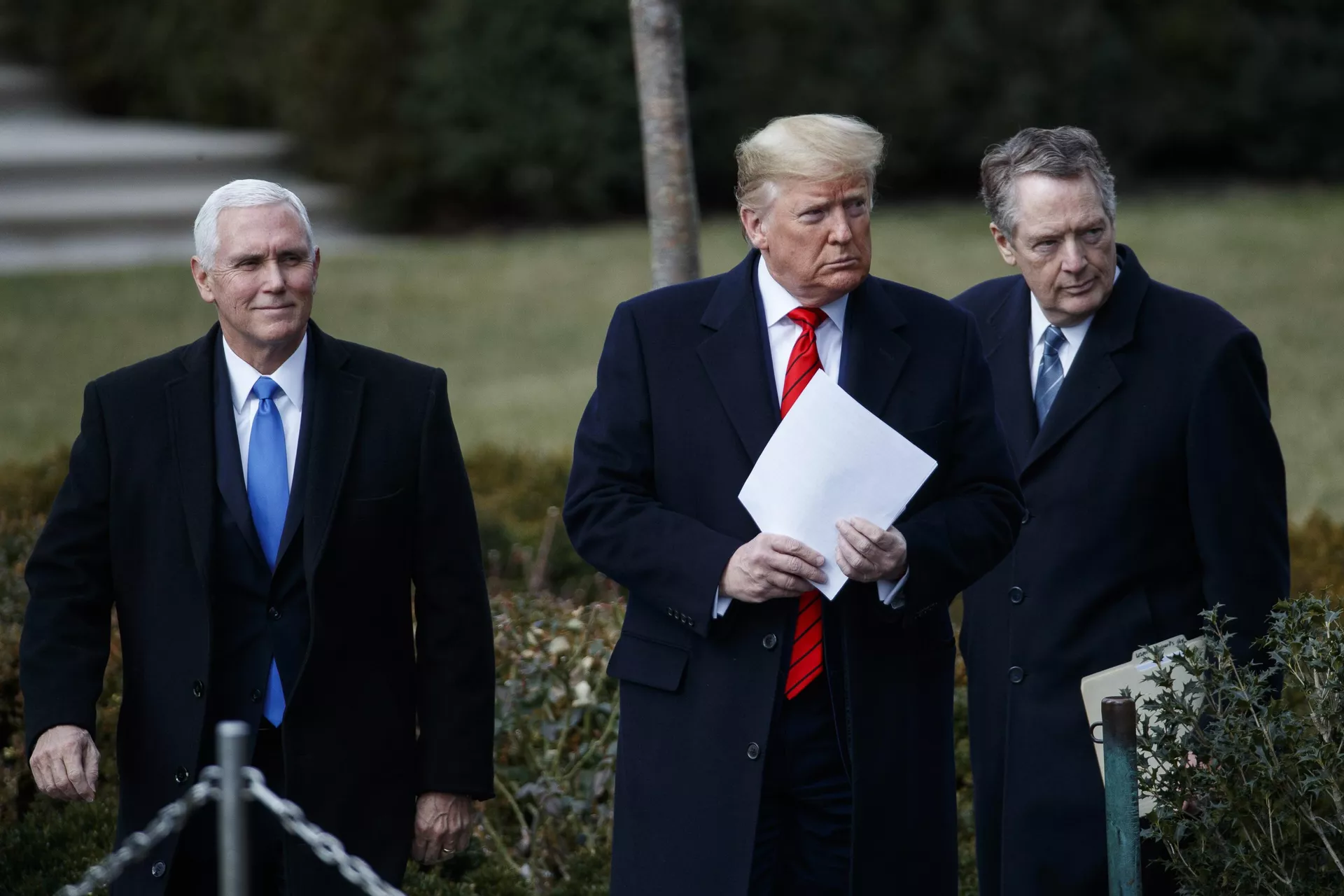 President Donald Trump, accompanied by Vice President Mike Pence, left, and US Trade Representative Robert Lighthizer, arrives to speak at an event at the White House to sign a new North American trade agreement with Canada and Mexico, Wednesday, Jan. 29, 2020, in Washington. - Sputnik International, 1920, 09.11.2024